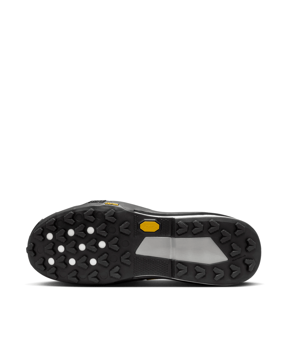 Black Vibram lugged outsole of the Nike Zegamadome x Sacai sneaker with yellow logo detail.